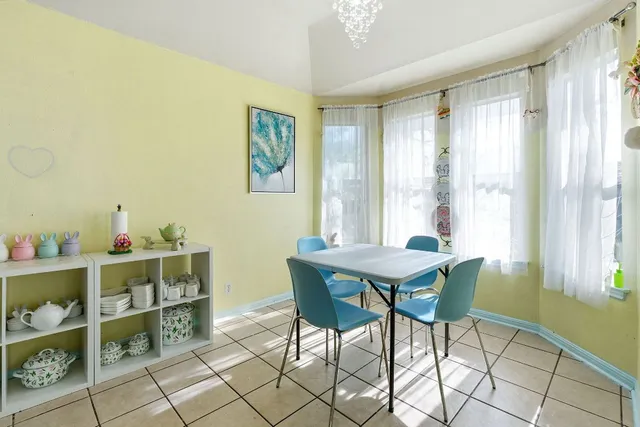 a kitchen with stainless steel appliances a stove refrigerator sink and cabinets