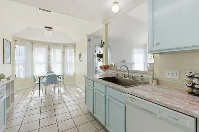 a bedroom with bed and a window