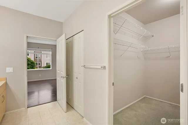 a view of a small space with wooden floor and a bathroom