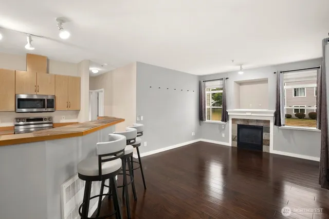 a view of a kitchen with furniture and a fireplace