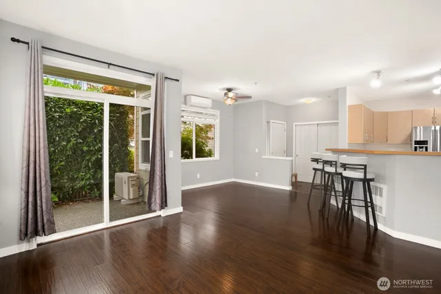 a view of kitchen with furniture and wooden floor
