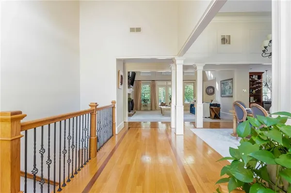 a close view of dining table with a fireplace and wooden floor
