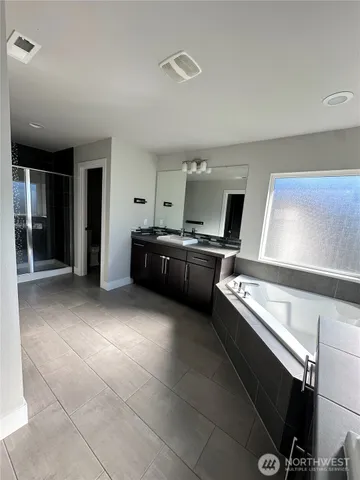 a kitchen with granite countertop a sink and a stove top oven