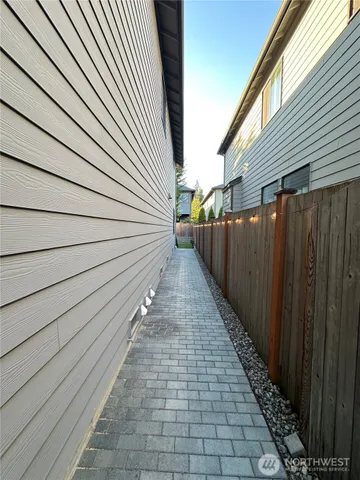 a view of a pathway with a backyard