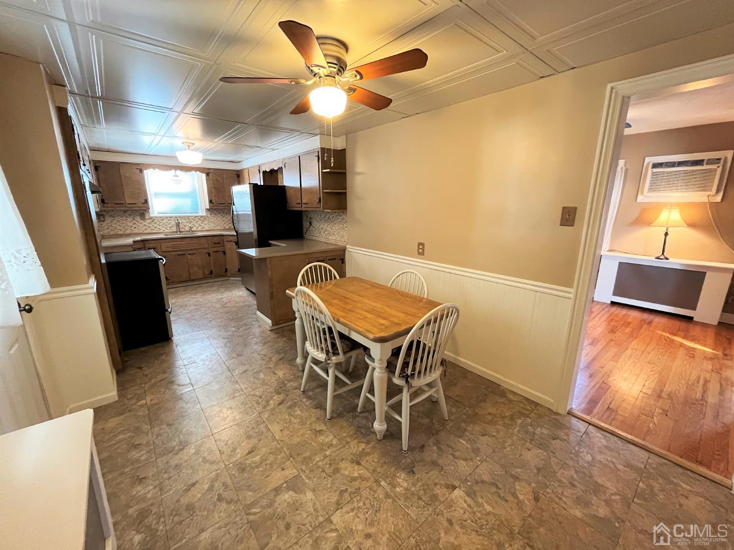 5 Outlook Avenue Colonia, NJ 07067 - Photo 3 of 21 a view of a dining room with furniture window and wooden floor