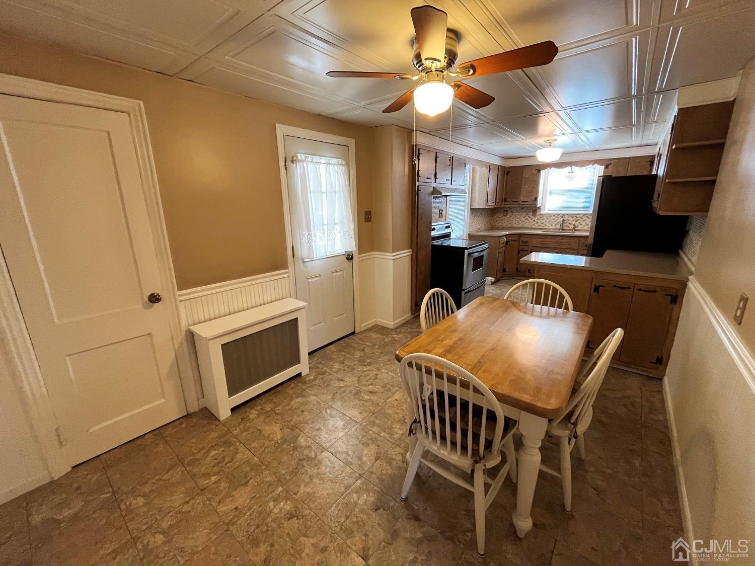 5 Outlook Avenue Colonia, NJ 07067 - Photo 4 of 21 a view of a dining room with furniture and a chandelier