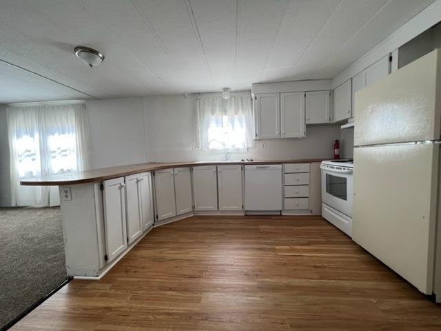 3349 F Road, Unit 14 Clifton, CO 81520 - Photo 7 of 10 a view of a kitchen with a sink and windows