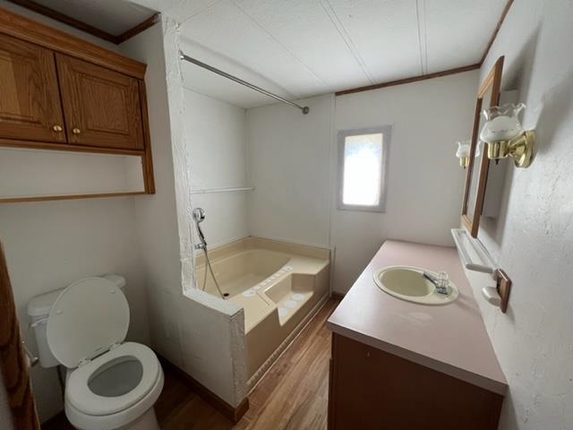 3349 F Road, Unit 14 Clifton, CO 81520 - Photo 8 of 10 a bathroom with a toilet sink and mirror