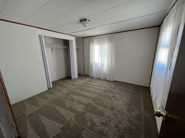 3349 F Road, Unit 14 Clifton, CO 81520 - Photo 9 of 10 an empty room with windows and closet