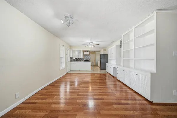 a view of kitchen with furniture and wooden floor
