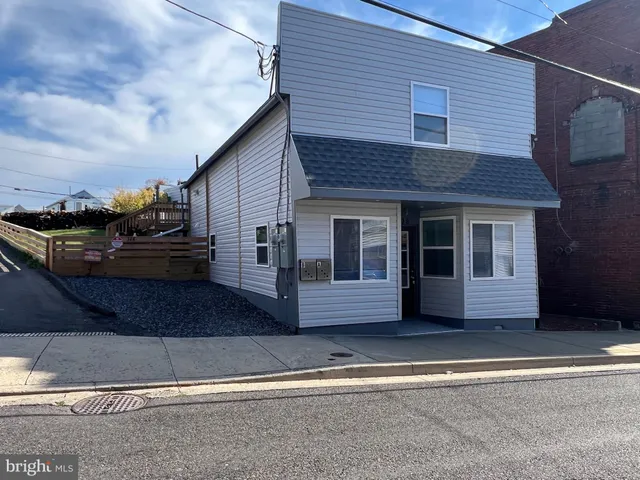 a front view of a house with a garage