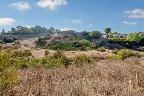 a view of a beach with a building in the background