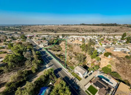 an aerial view of a residential houses with outdoor space