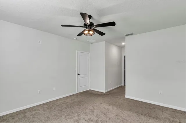a view of a ceiling fan in a room