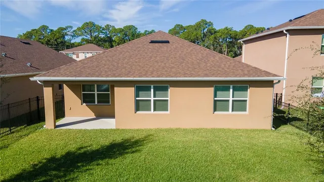 a front view of a house with a yard and porch
