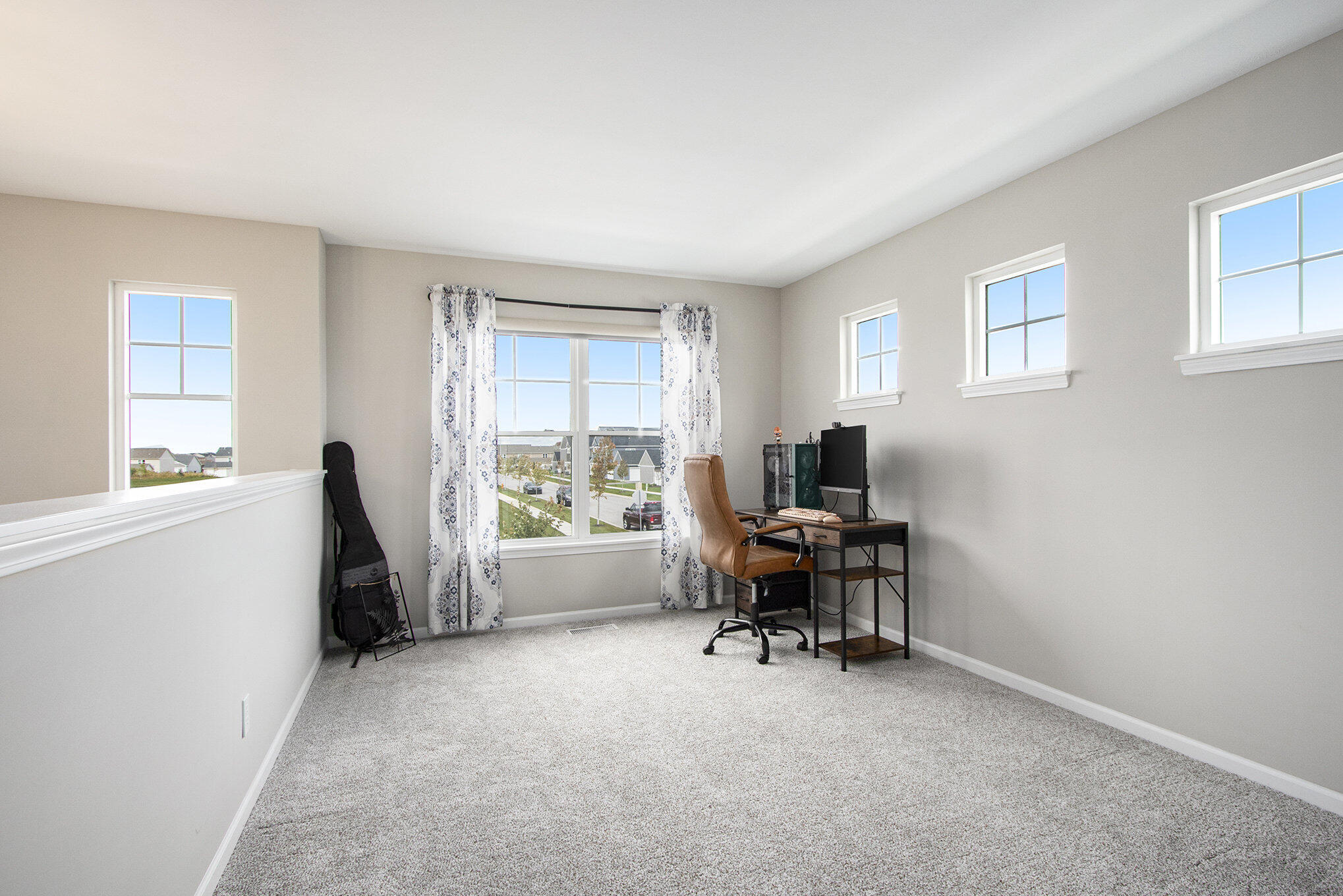 1053 East 117th Lane Crown Point, IN 46307 - Photo 13 of 23 a view of workspace with wooden floor and windows