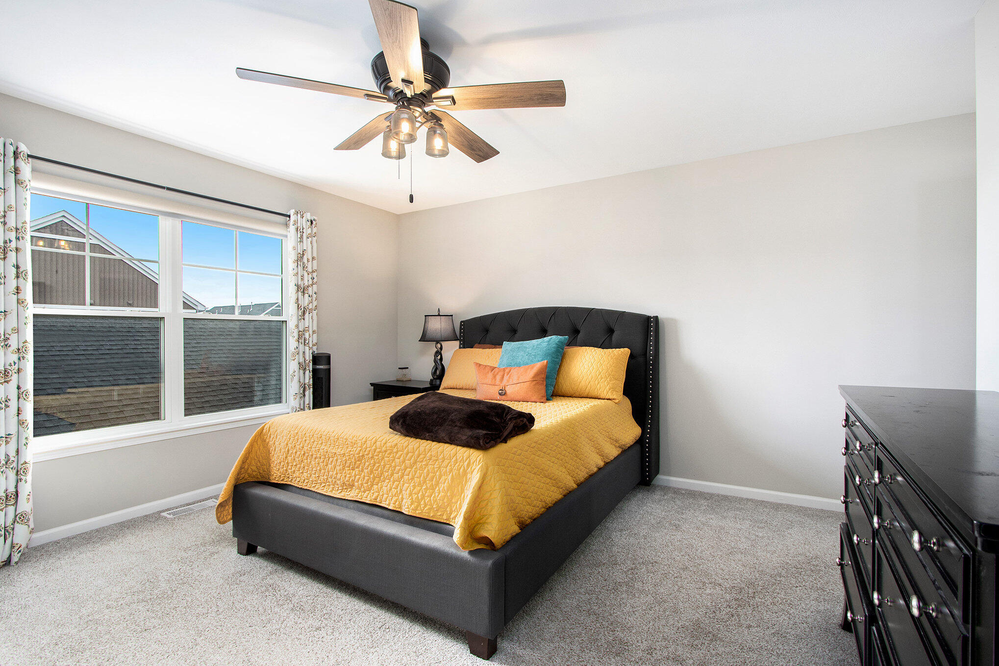 1053 East 117th Lane Crown Point, IN 46307 - Photo 15 of 23 a bedroom with a bed and a chandelier