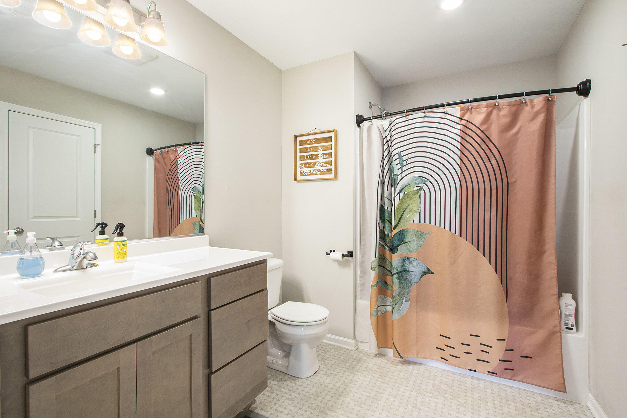 1053 East 117th Lane Crown Point, IN 46307 - Photo 17 of 23 a bathroom with a sink a toilet and a mirror