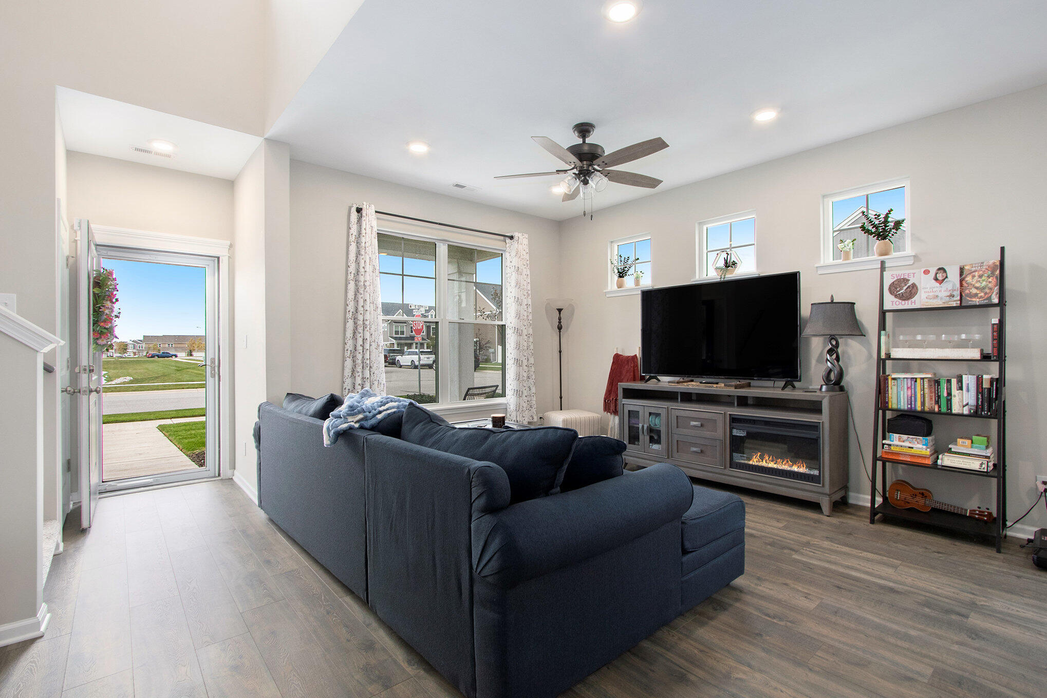 1053 East 117th Lane Crown Point, IN 46307 - Photo 5 of 23 a living room with furniture and a flat screen tv