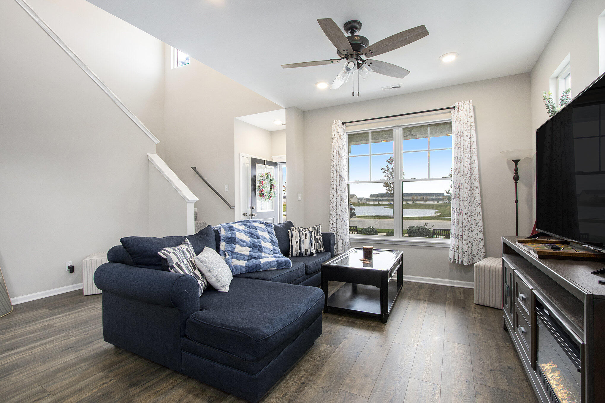 1053 East 117th Lane Crown Point, IN 46307 - Photo 6 of 23 a living room with furniture and a flat screen tv