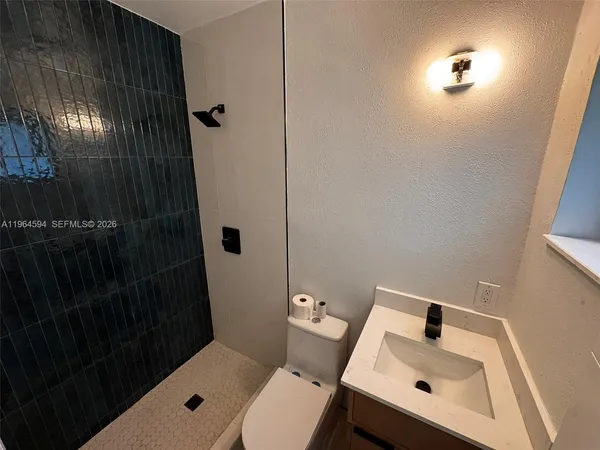 a bathroom with a sink and toilet
