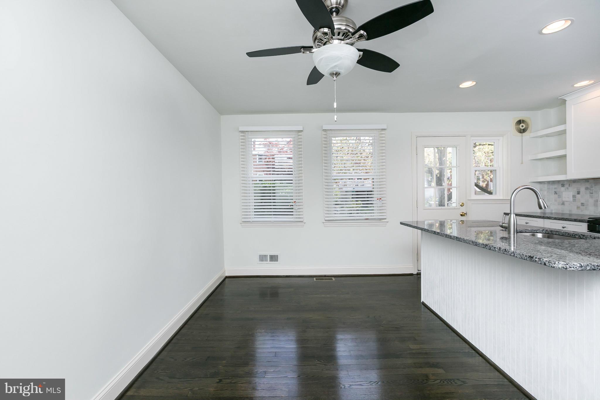 1636 Aberdeen Road Baltimore, MD 21286 - Photo 14 of 30 a view of a kitchen with a sink and wooden floor
