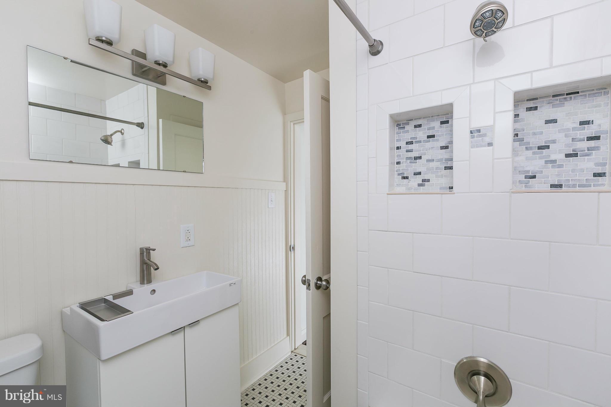 1636 Aberdeen Road Baltimore, MD 21286 - Photo 23 of 30 a bathroom with a sink toilet and shower