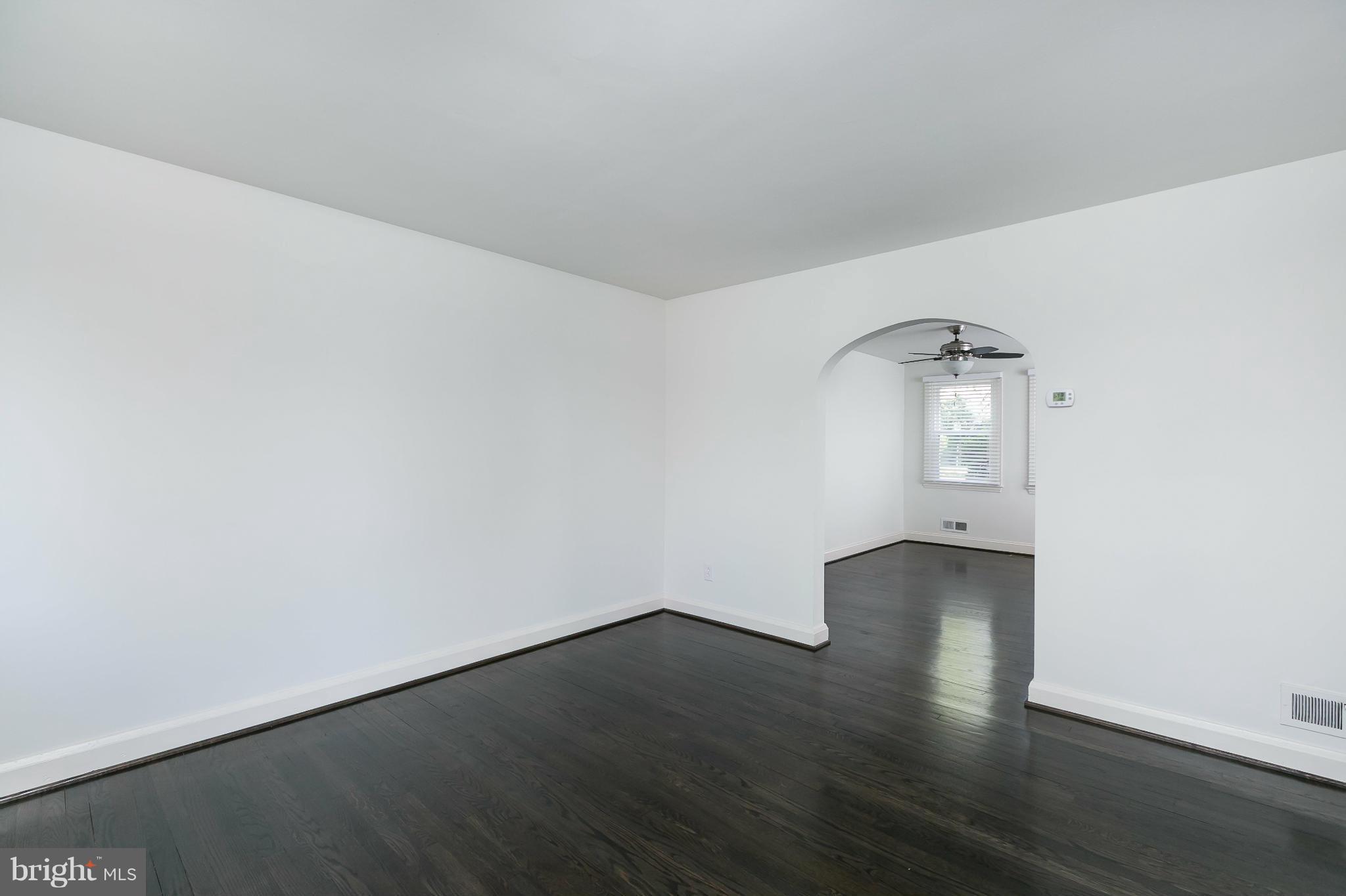 1636 Aberdeen Road Baltimore, MD 21286 - Photo 4 of 30 an empty room with wooden floor and windows