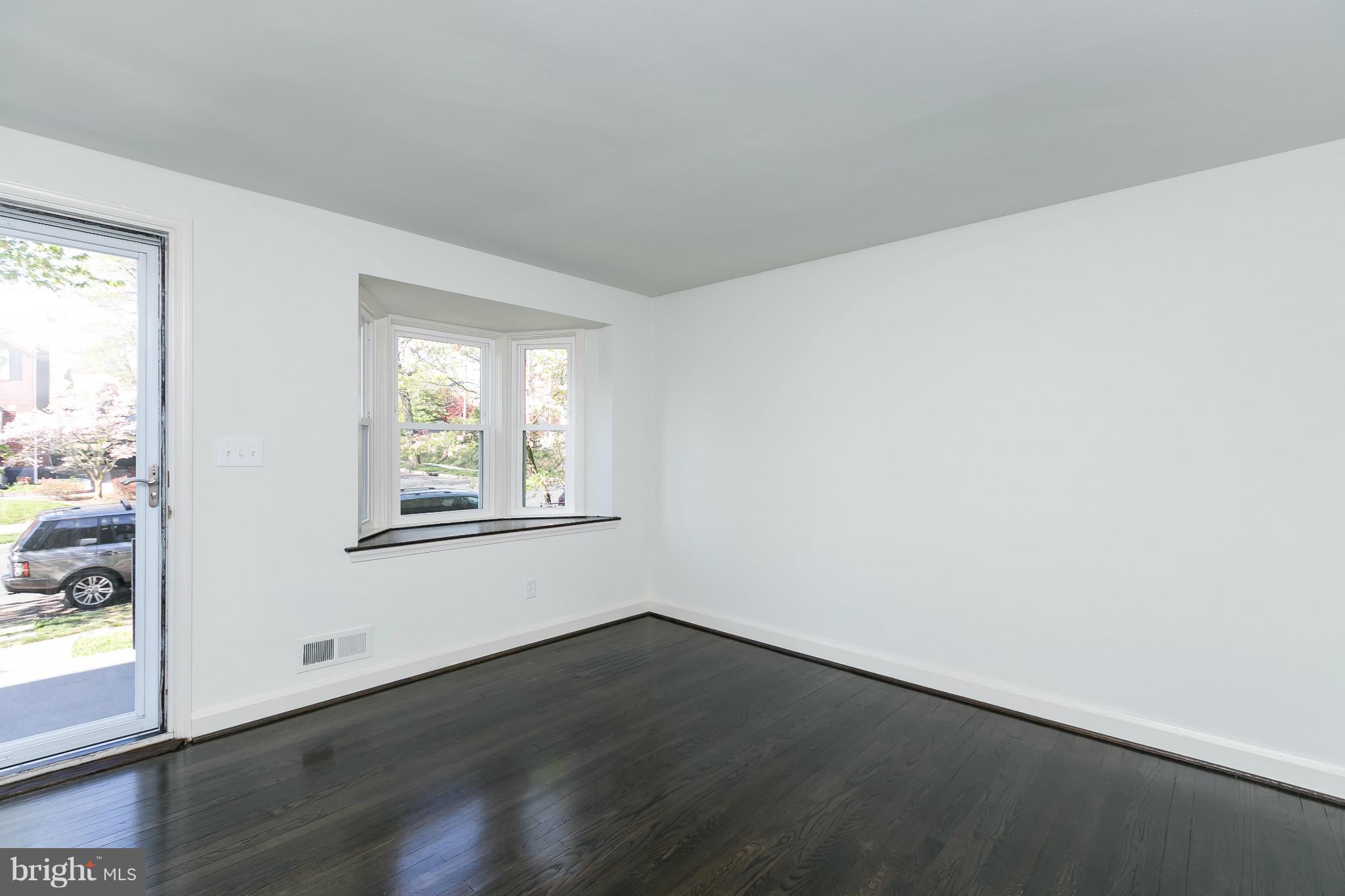 1636 Aberdeen Road Baltimore, MD 21286 - Photo 5 of 30 an empty room with wooden floor and windows