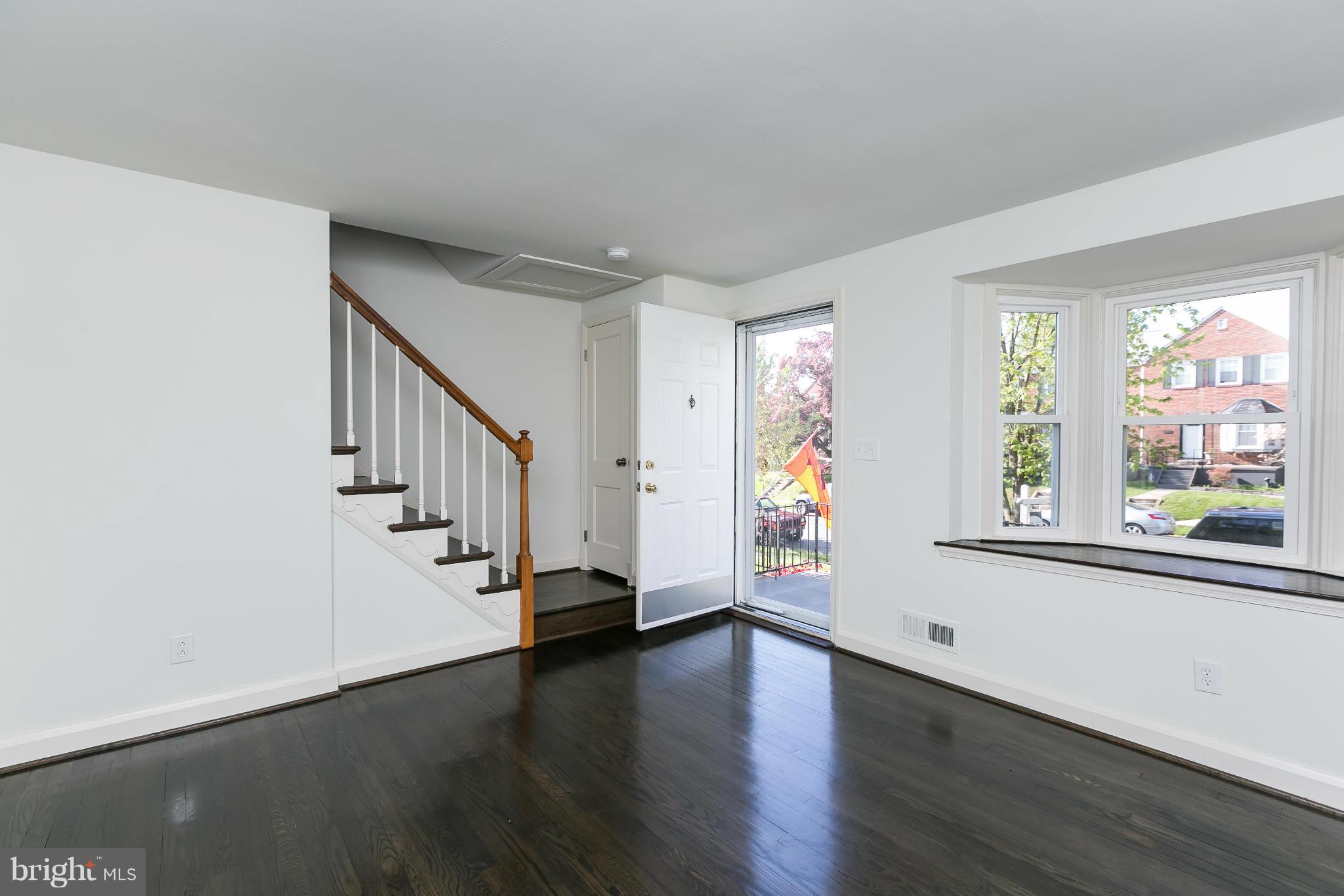 1636 Aberdeen Road Baltimore, MD 21286 - Photo 6 of 30 wooden floor in an empty room with a window