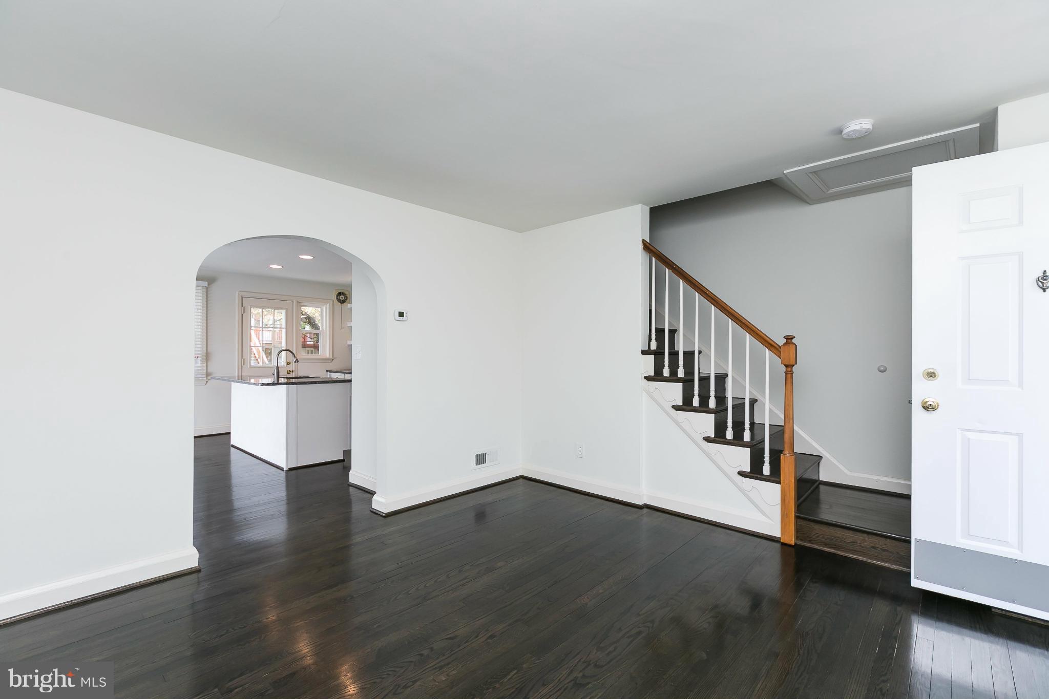 1636 Aberdeen Road Baltimore, MD 21286 - Photo 7 of 30 a view of a hallway with wooden floor and staircase