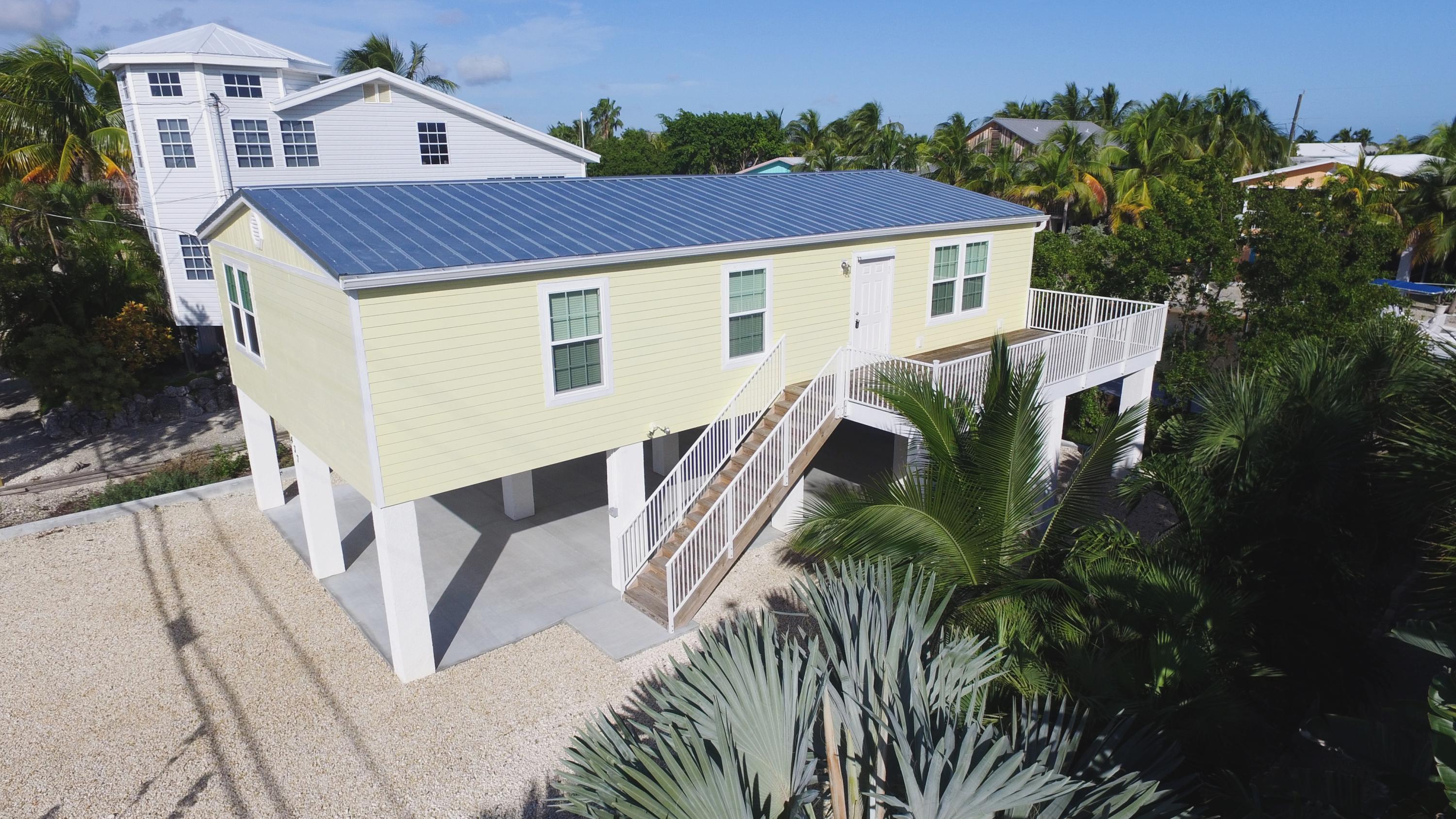 a aerial view of a house with a yard
