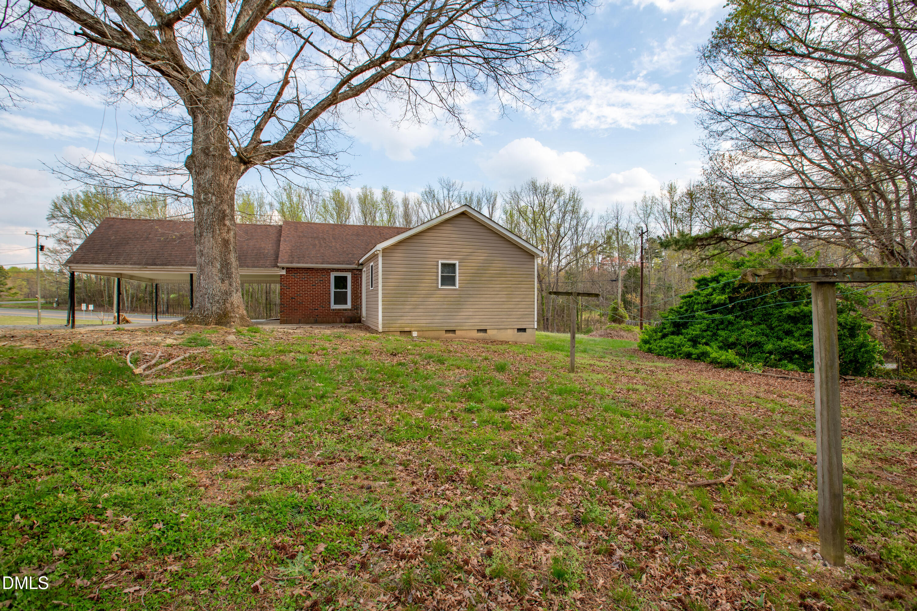 4295 Virgilina Road Roxboro, NC 27574 - Photo 36 of 46 a front view of house with yard and trees around