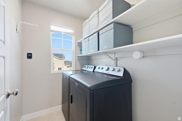 3244 West 1670th Street North Provo, UT 84601 - Photo 24 of 56 Dedicated laundry room featuring a double window, overhead shelving, and a wall-mounted drying rack