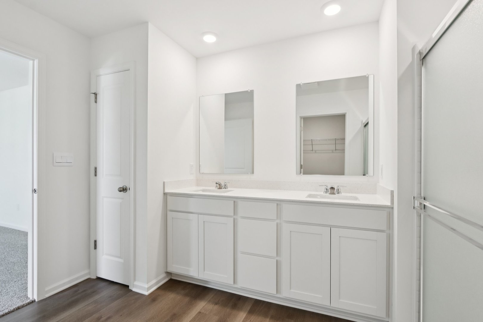 2957 Rushmore Drive Pingree Grove, IL 60140 - Photo 13 of 36 a bathroom with double vanity sinks and a mirror