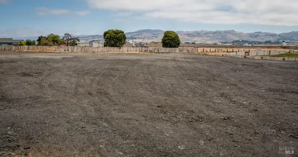 a view of a street with an ocean view