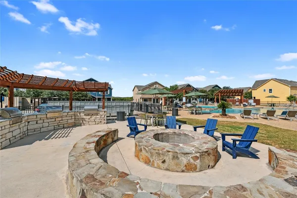 a view of a swimming pool with outdoor seating space