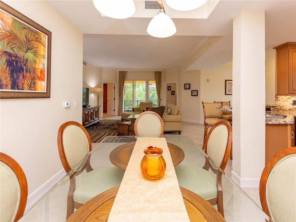 16101 Emerald Estates Drive, Unit 252 Weston, FL 33331 - Photo 13 of 51 a room with furniture and wooden floor