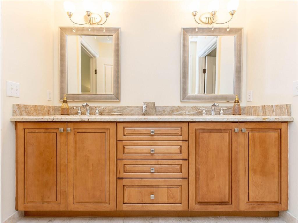 16101 Emerald Estates Drive, Unit 252 Weston, FL 33331 - Photo 18 of 51 a bathroom with a sink vanity and mirror