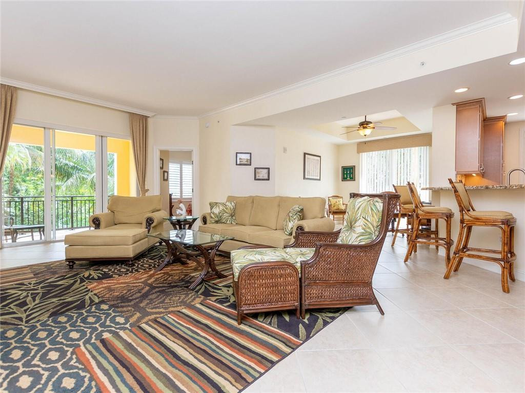 16101 Emerald Estates Drive, Unit 252 Weston, FL 33331 - Photo 2 of 51 a living room with furniture and a large window