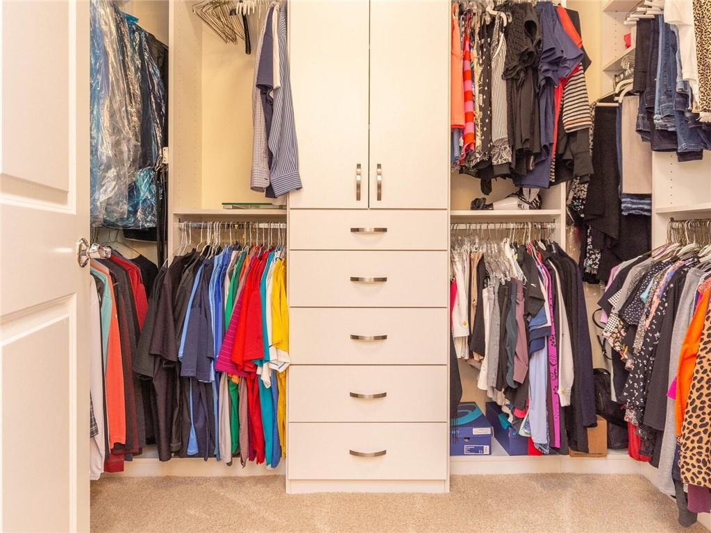 16101 Emerald Estates Drive, Unit 252 Weston, FL 33331 - Photo 21 of 51 a view of walk in closet with clothes
