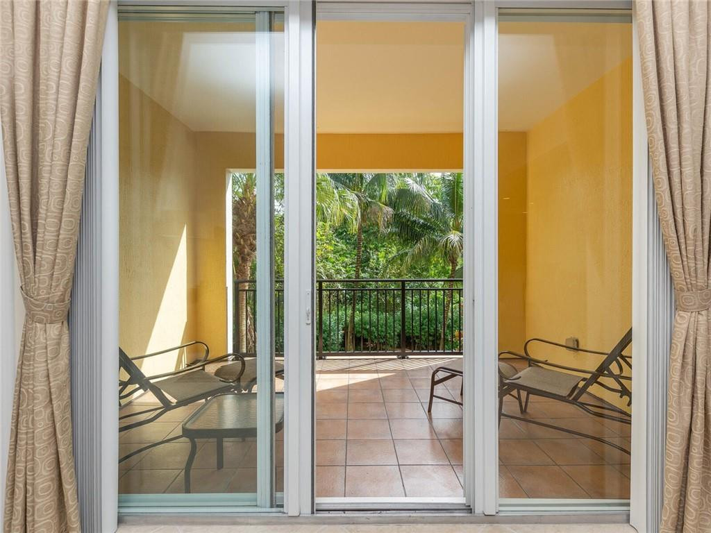 16101 Emerald Estates Drive, Unit 252 Weston, FL 33331 - Photo 24 of 51 a view of a bathroom with a tub and glass door