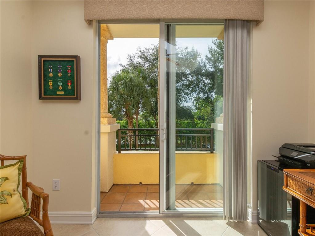 16101 Emerald Estates Drive, Unit 252 Weston, FL 33331 - Photo 25 of 51 a view of a room that has a bed and wooden floor