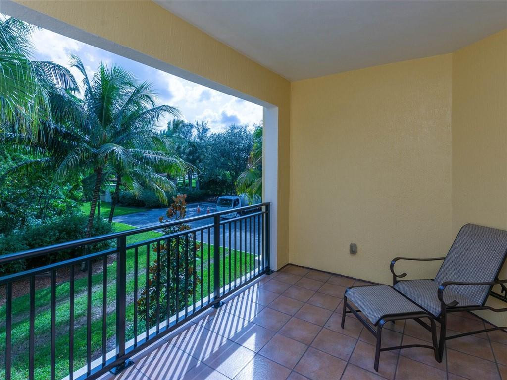 16101 Emerald Estates Drive, Unit 252 Weston, FL 33331 - Photo 26 of 51 a view of a chair and table in the balcony
