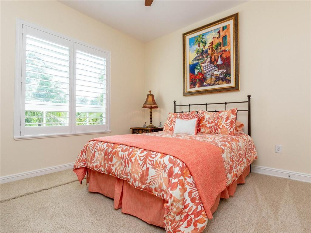 16101 Emerald Estates Drive, Unit 252 Weston, FL 33331 - Photo 27 of 51 a bed sitting in a bedroom next to a window