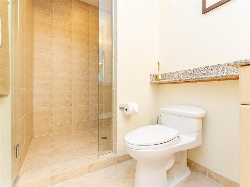 16101 Emerald Estates Drive, Unit 252 Weston, FL 33331 - Photo 30 of 51 a bathroom with a toilet and a shower