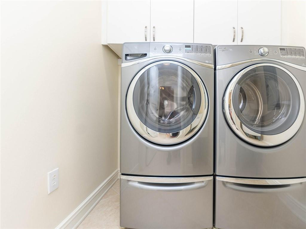 16101 Emerald Estates Drive, Unit 252 Weston, FL 33331 - Photo 31 of 51 a utility room with dryer and washer