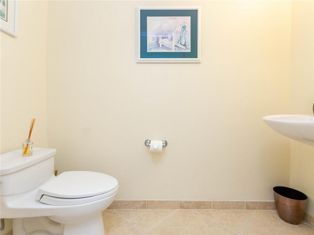16101 Emerald Estates Drive, Unit 252 Weston, FL 33331 - Photo 33 of 51 a white toilet sitting next to a white wall