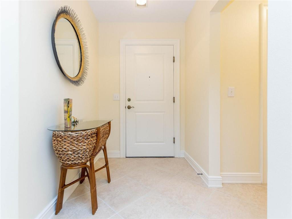 16101 Emerald Estates Drive, Unit 252 Weston, FL 33331 - Photo 34 of 51 a room with a table and a chair