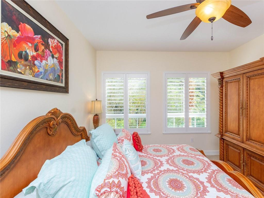 16101 Emerald Estates Drive, Unit 252 Weston, FL 33331 - Photo 35 of 51 a bedroom with a bed and a painting on the wall